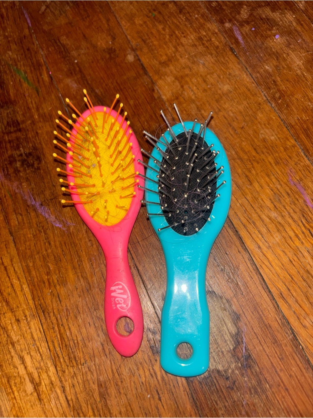 Pink and blue hairbrushes for dolls